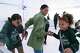 Ayesha Curry, center, helps her daughters Ryan Curry, 7, right, and Riley Curry, 10, keep their balance at the ice skating rink during the Christmas with the Currys event at the Bridge Yard in Oakland, California on Sunday, December 11, 2022. The “Winter Wonderland” themed gathering distributed gifts to over 500 Oakland families, as part of the Curry’s Eat Learn Play organization.