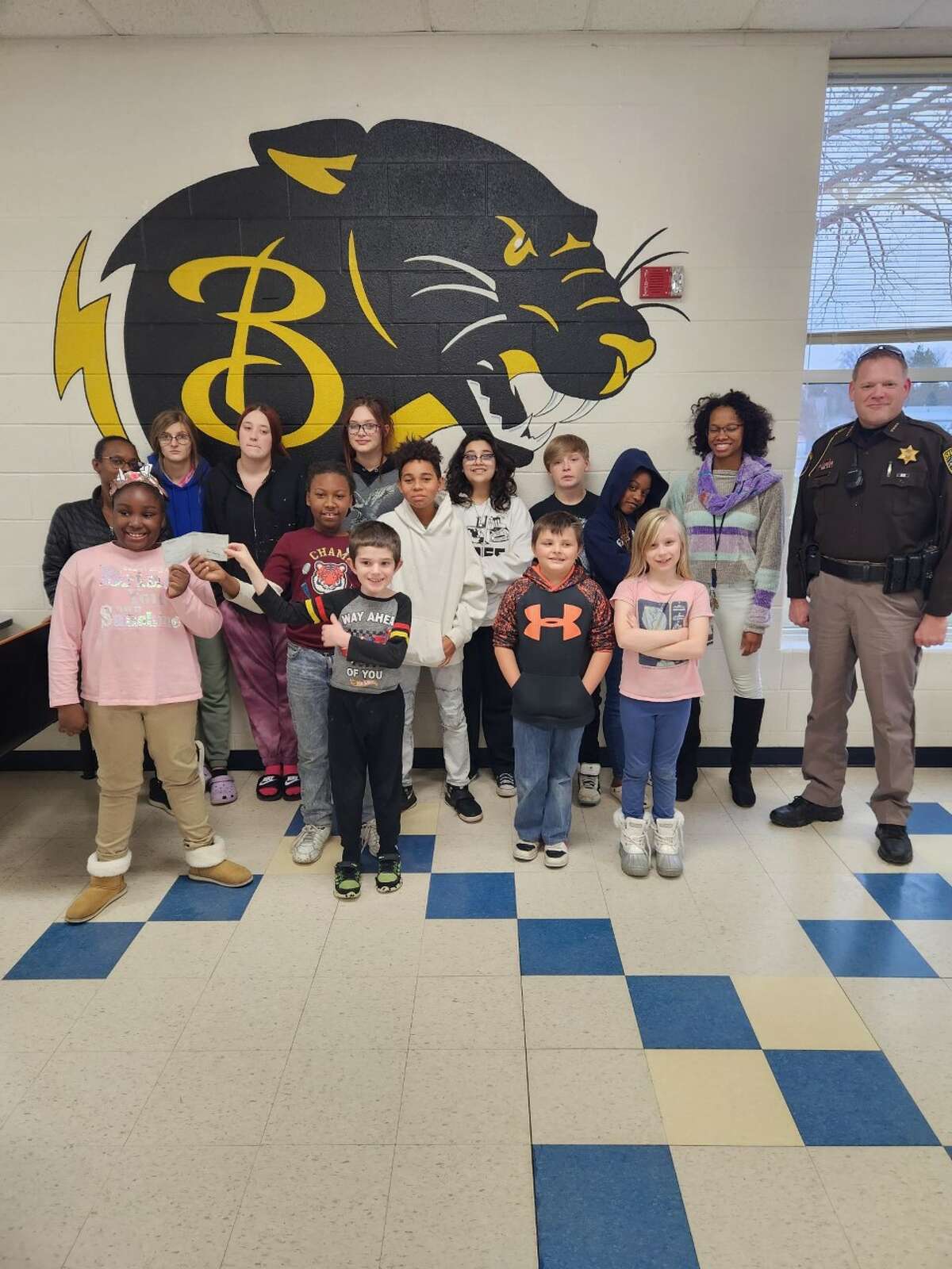 Lake County Sheriff Rich Martin (far right) recently presented the Baldwin Community Schools ABC Kids' Awareness Gardening program with a donation of $1,000, part of the ongoing LCSO Charitable Campaign to support local nonprofits.