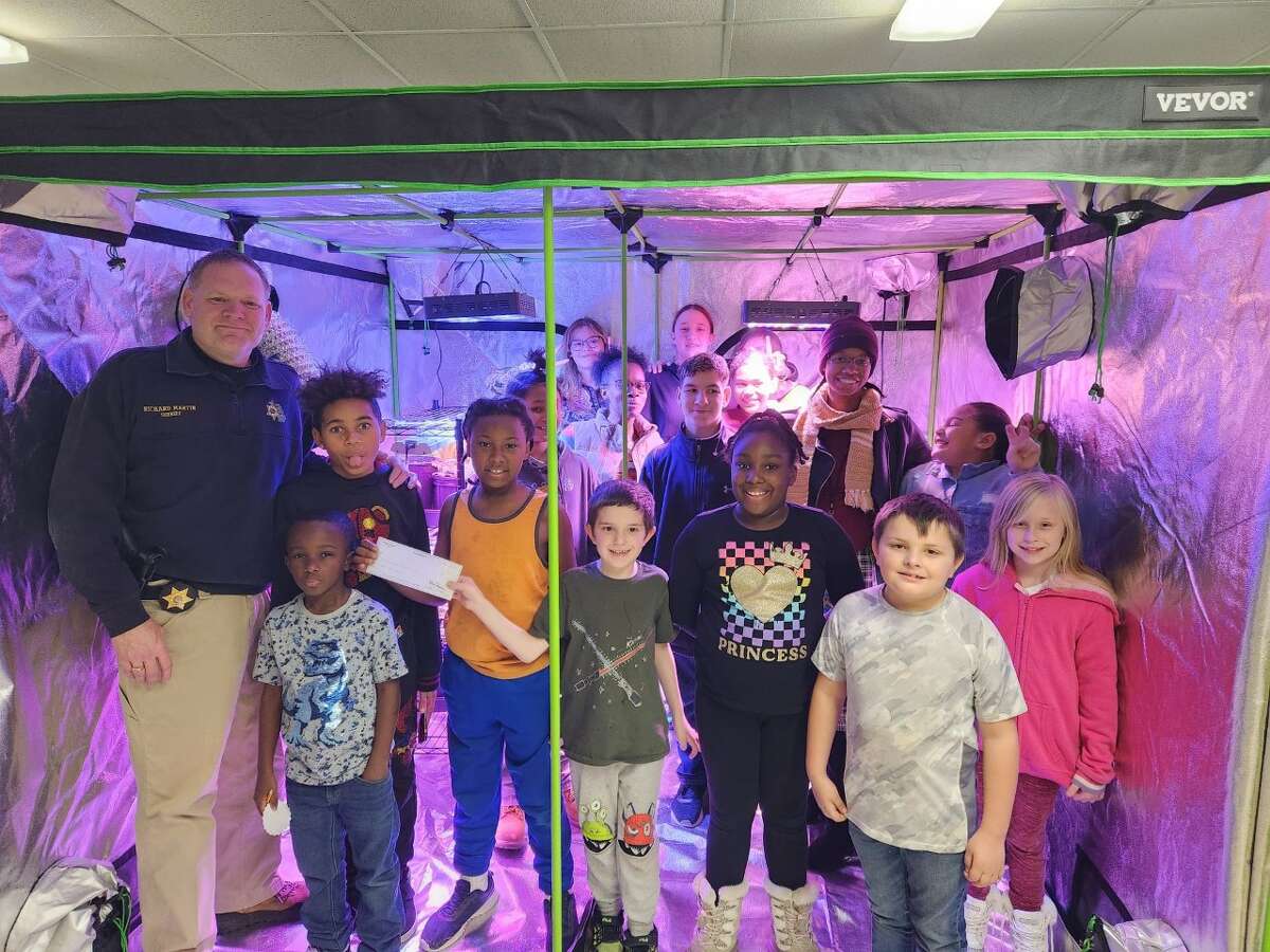 Lake County Sheriff Rich Martin (far left) recently presented the Baldwin Community Schools ABC Kids' Awareness Gardening program with a donation of $1,000, part of the ongoing LCSO Charitable Campaign to support local nonprofits.