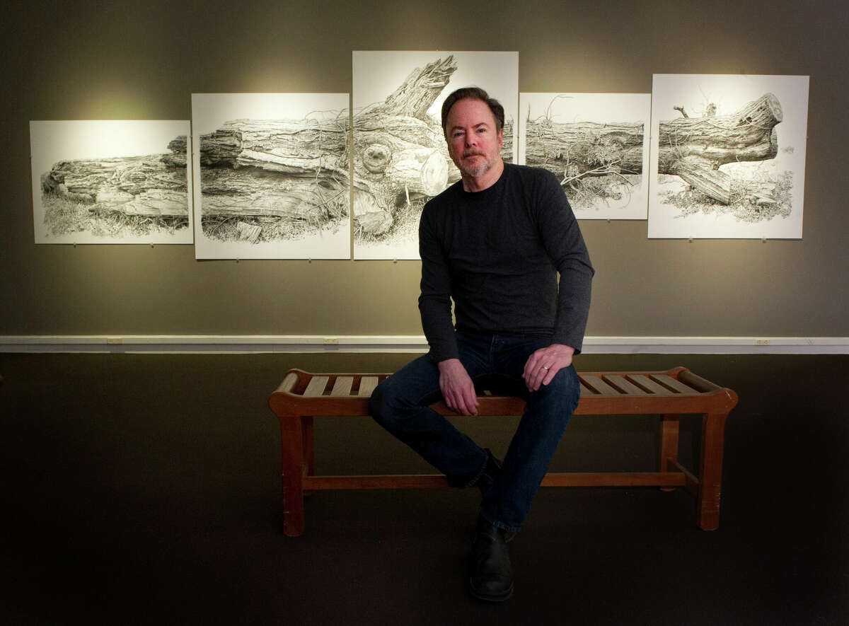 Rick Shaefer poses for a photo with his charcoal on vellum artwork at the Stamford Museum and Nature Center on March 19, 2014. 