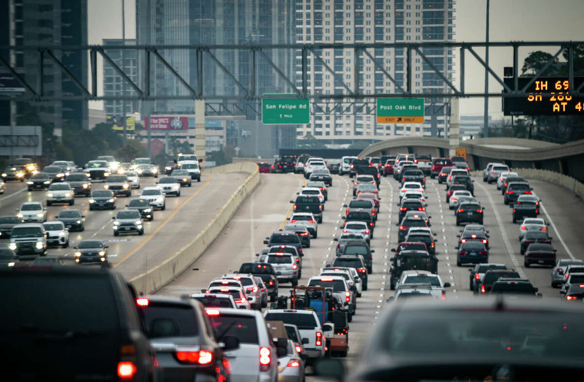 Traffic moves along the 610 West Loop during rush hour, Friday, Jan. 7, 2022, in Houston.
