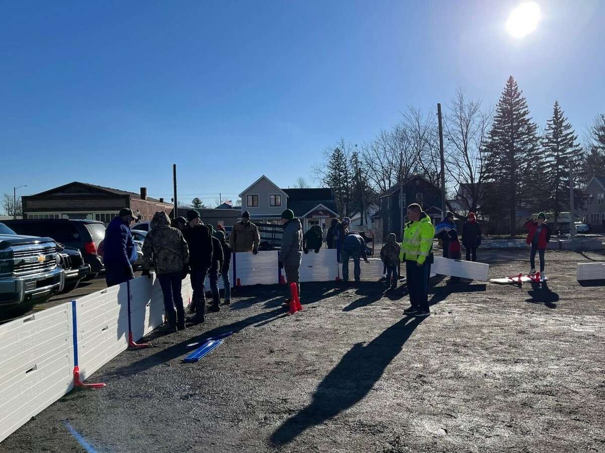 Several local officials, along with boy scout and citizen volunteers came out to help get the ice rink in Reed City set up and ready for skaters. The ice rink is located on Chestnut Street next to Pompeii's Pizza.