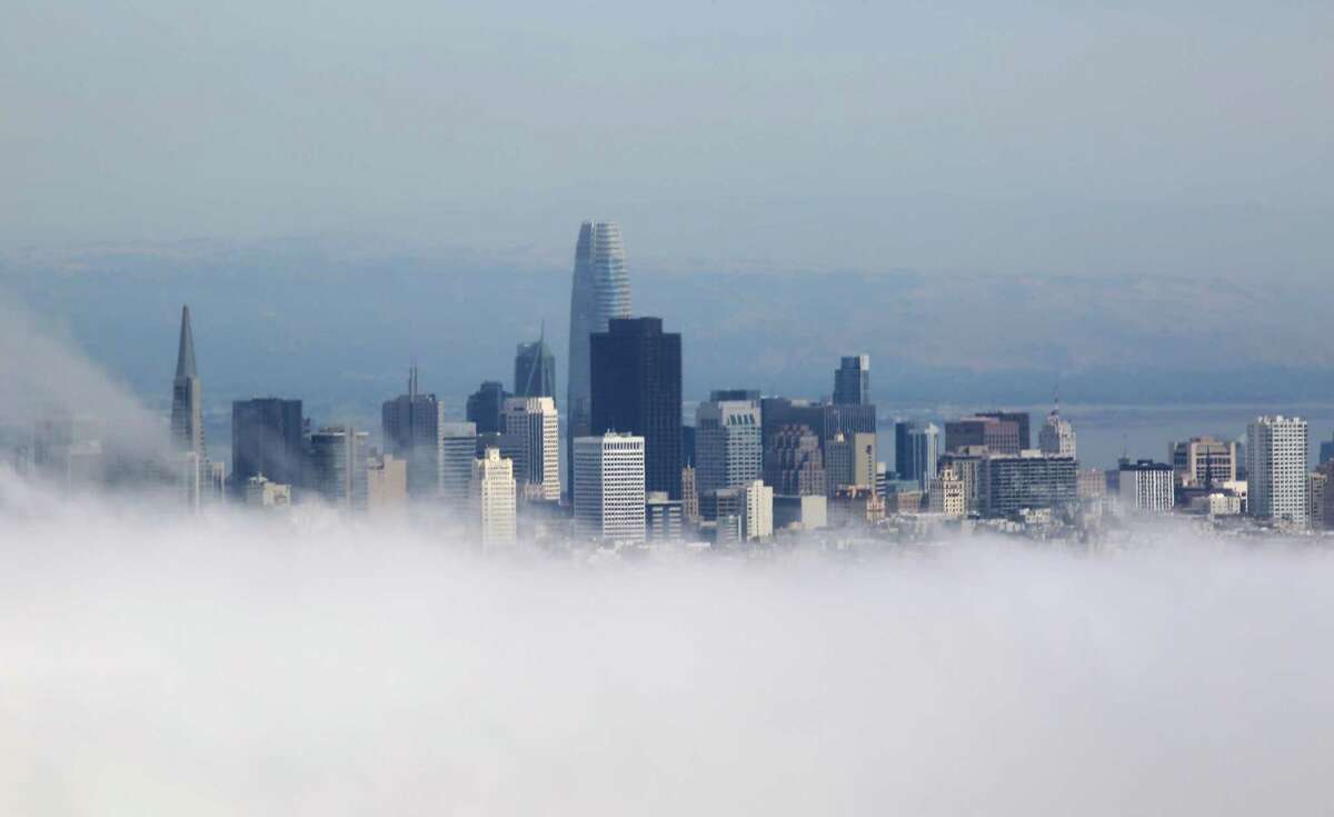 ChatGPT was asked to write an SF news story. Here’s what it did. Fog rolls past the San Francisco skyline in San Francisco, Calif.