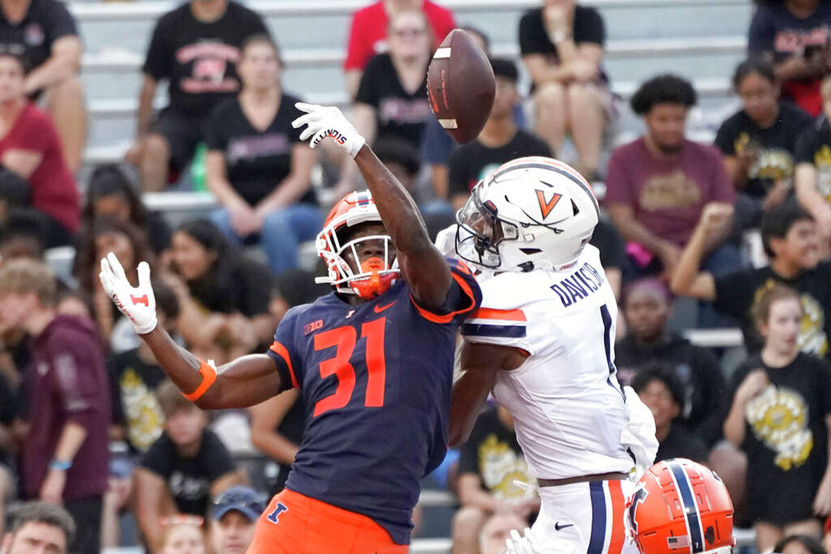 Illinois defensive back Devon Witherspoon breaks up a pass in the end zone intended for Virginia's Lavel Davis Jr., during the second half of an NCAA college football game Saturday, Sept. 10, 2022, in Champaign, Ill. Illinois won 24-3. 