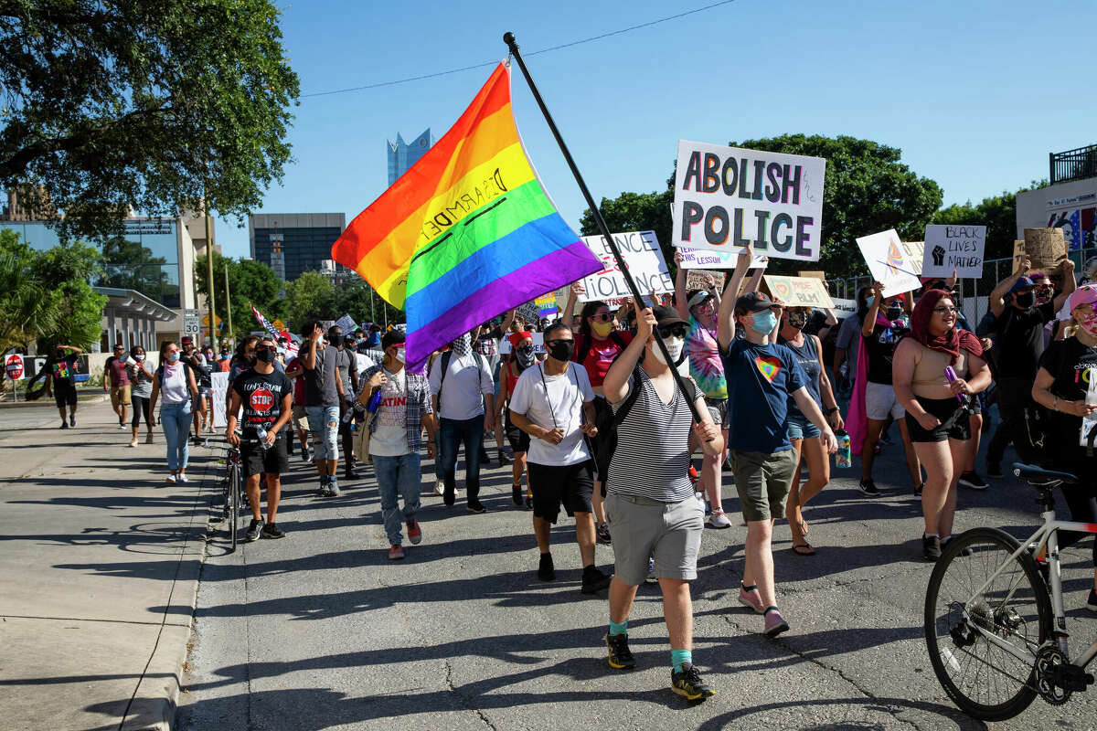 Protesters march down Main St. during the Queer Black Lives Matter protest and march in San Antonio, Texas, U.S. on Saturday, June 13, 2020.