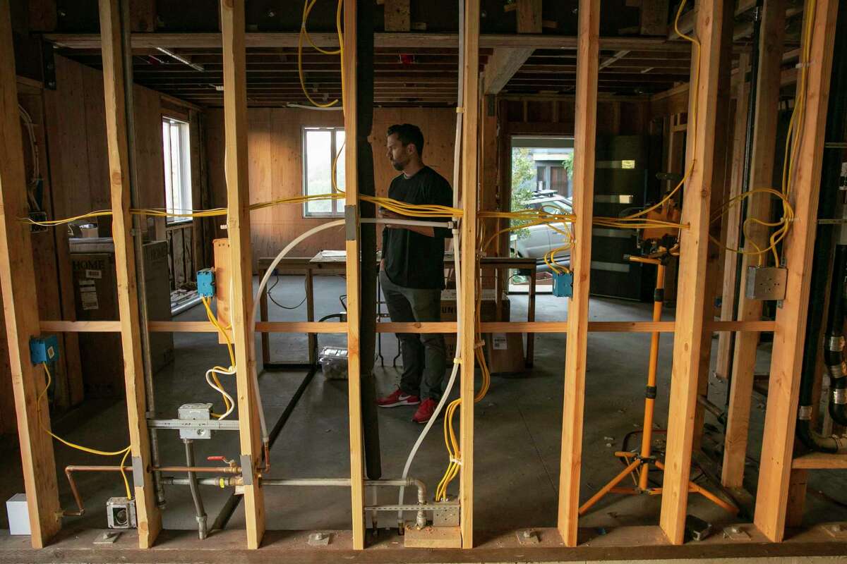 Scott Pluta shows off the accessory dwelling unit under construction on the ground floor of his home in San Francisco.