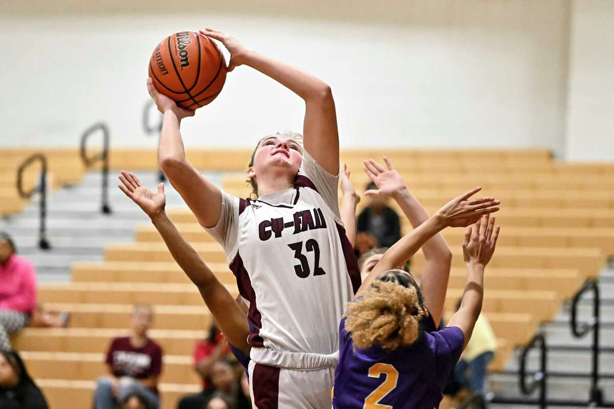 Cy Fair Bobcats forward Anna Farrell (32) shoots the ball against the Jersey Village Falcons during the first half during a District 17-6A game in Cypress, Tuesday, Dec. 13, 2022.
