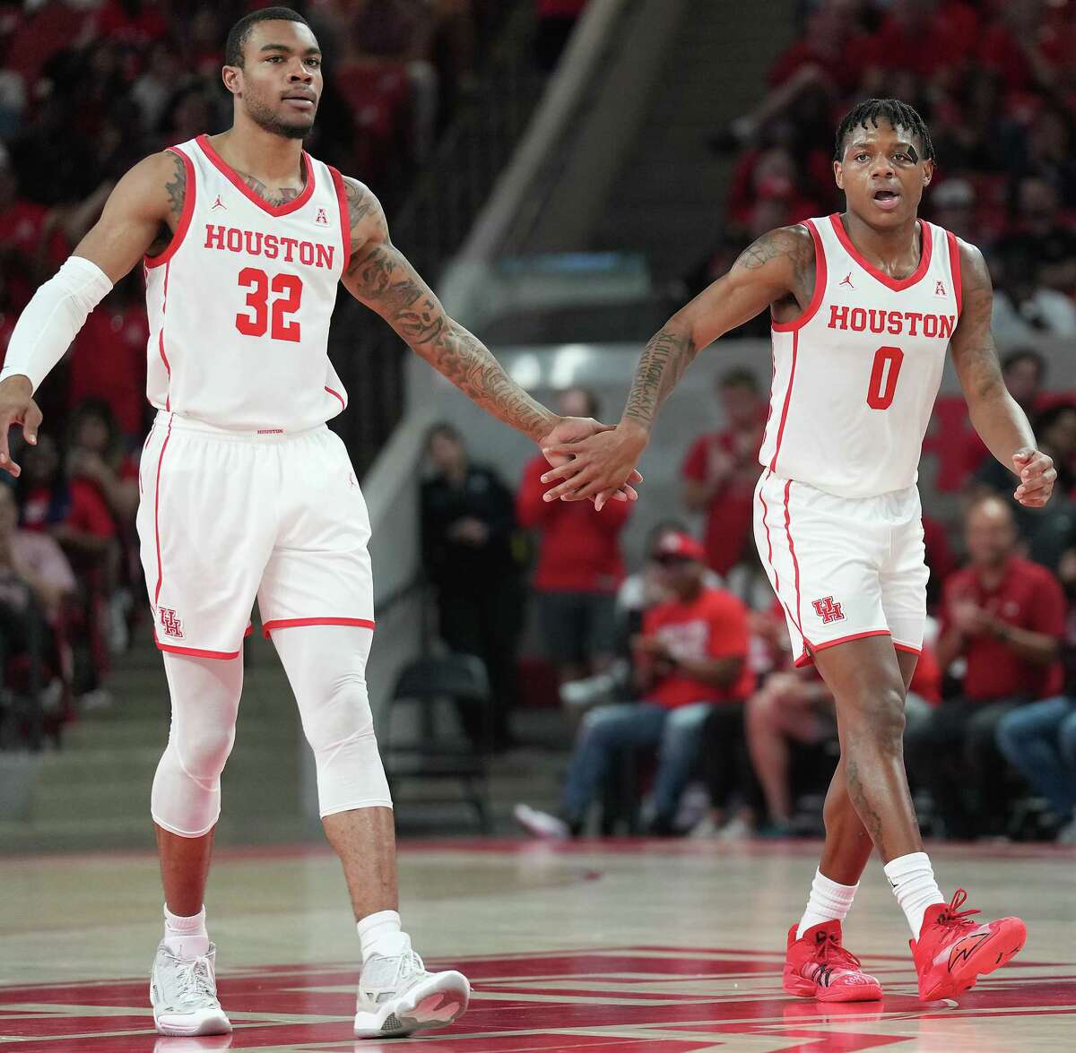 Forward Reggie Chaney (32) and guard Marcus Sasser are but two pieces of a deeply talented UH squad. 