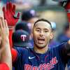 Minnesota Twins' Carlos Correa, right, is congratulated after hitting a solo home run against the Los Angeles Angels during the first inning of a baseball game in Anaheim, Calif., Saturday, Aug. 13, 2022. (AP Photo/Alex Gallardo)