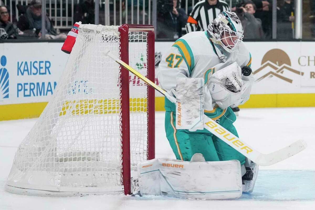 San Jose Sharks goaltender James Reimer blocks a shot against the Arizona Coyotes during the second period of an NHL hockey game in San Jose, Calif., Tuesday, Dec. 13, 2022. (AP Photo/Godofredo A. Vásquez)