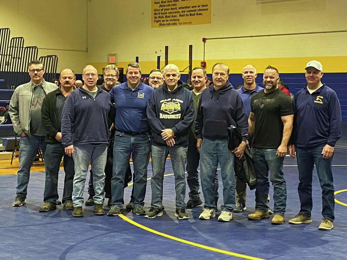 Wayne Brady, middle, poses with his former wrestlers and others during the special moment at a recent wrestling tournament. Brady was honored with the renaming of a tournament he started to the Wayne Brady Classic. 