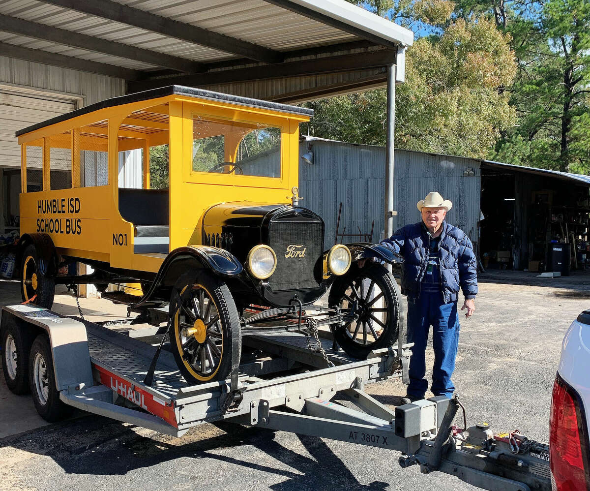 Alton Hues stands beside the completed 1927 Model T Ford replica bus he donated to the Humble Museum just moments before it left his property. Lovie Summerlin Hues nicknamed the bus the 'chicken coop' because the bus had no windows, only chicken wire to prevent students from putting their hands outside the windows.