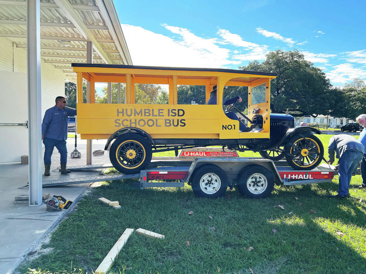 The 1927 Model T Ford replica school bus arrives at the museum. Crews had to measure to make sure the large-sized donation would fit in the doors to the Humble Museum just days before Thanksgiving.