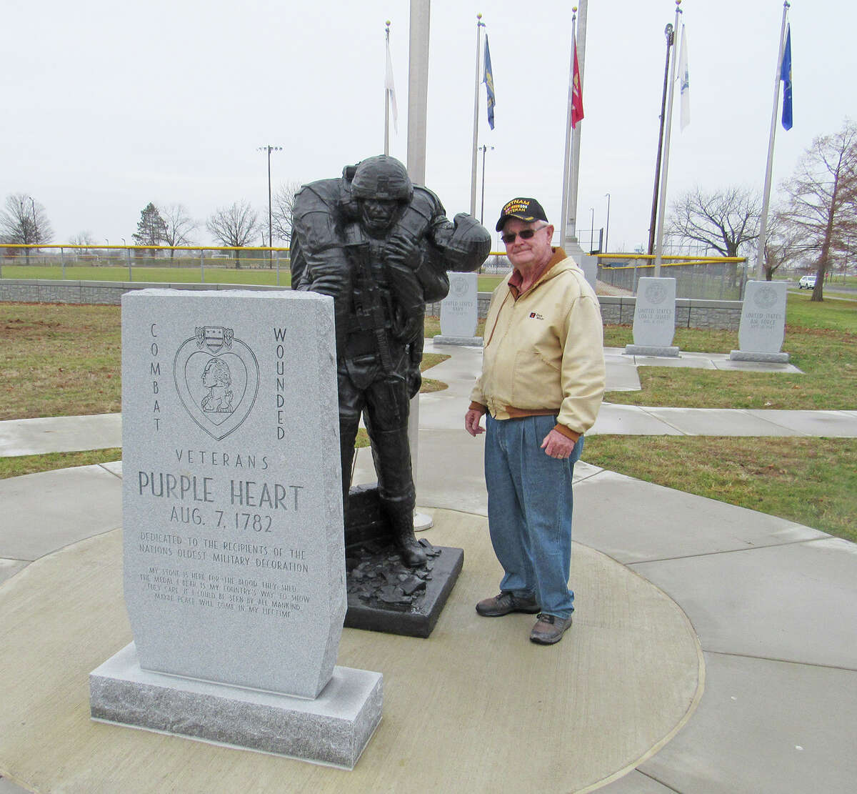 Tim Greenfield at the Purple Heart stone and statue, which is part of the new field of Honor and Service at Tri-Township Park in Troy. Greenfield spearheaded the effort to design the veterans’ memorial, which was originally built in 1992.