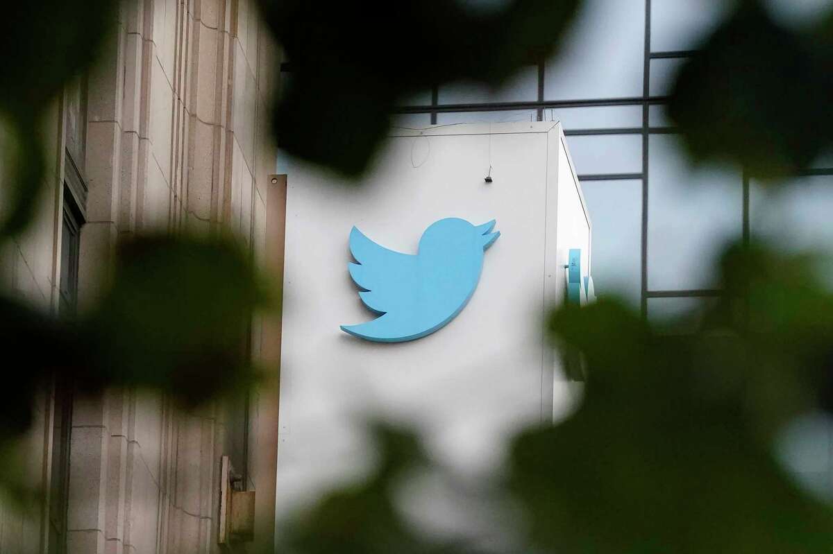 FILE - A sign at Twitter headquarters is shown in San Francisco, Thursday, Dec. 8, 2022. Twitter has suspended an account that used publicly available flight data to track Elon Musk's private jet, despite a pledge by the social media platform's new owner to keep it up because of his free speech principles.