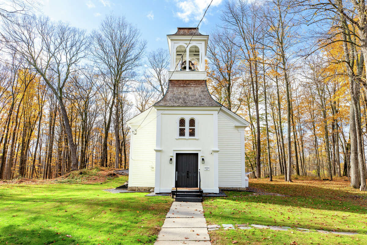 Without seeing the photos with this listing, it would sound fairly typical: A three-bedroom, one-and-a-half bathroom home under 2,000 square feet, on just under an acre of land. But when you see how that square footage is contained, maybe your jaw does what mind did, and drops a little.  The North Church was built in 1867 and has been updated to serve modern life. There are original touches that play up the church’s charm, like wood beams framing the 30-foot ceilings, the bell hanging from the tower and beautiful stained glass windows throughout the house. The majority of the house has newer features, from the deck and outdoor fireplace to the modern kitchen and bathrooms. It comes fully furnished, so turnkey is the keyword. New HVAC and septic systems. Taxes: $2,500. Listing price: $795,000. For more information, contact Erin Sipowicz, of the Erin Sipowicz Team of Howard Hanna Real Estate, at 518-307-6348 or erinsipowicz@howardhanna.com.