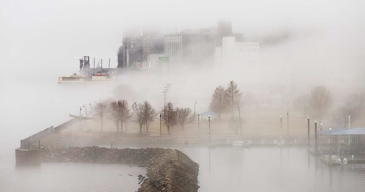 John Badman|The Telegraph Eerie fog floated across the Alton riverfront Wednesday morning. The fog stuck around both by the river and in North Alton for hours in the cloudy weather. The moderate temperatures have had their last stand for a while, according to forecasters who are predicting highs only in the 30's for the next seven days.