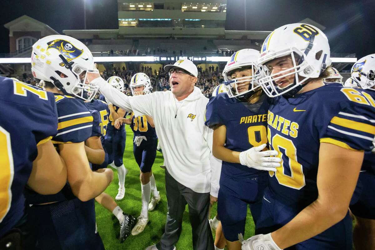 Poth head coach Jeff Luna celebrates with his team after defeating Harmony 51-28 in a Class 3A Division II state semifinal high school football playoff game between Poth and Gilmer Harmony Friday, Dec 9, 2022, in Cypress.
