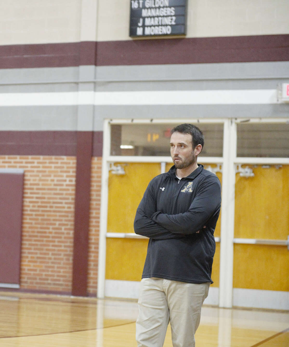 Andrews coach Todd Warren looks from the sidelines during a Dec. 13 basketball game against Legacy at Rebel Gymnasium. 