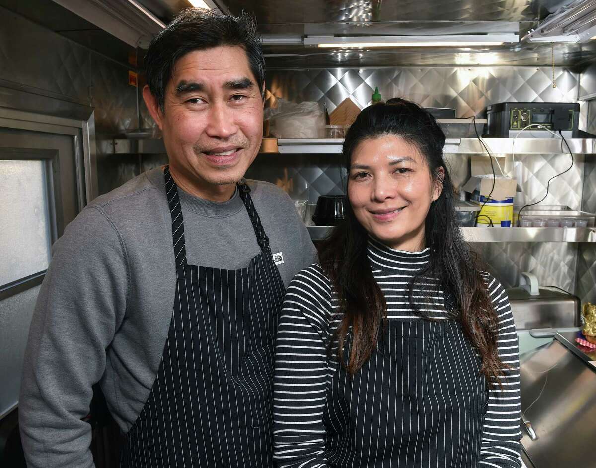 The Ramen Station owners Thawatchai "Bill" Boonyalai and his wife, Chattapron "Jane" Tintachart, are photographed inside their food truck parked at the corner of College and Elm Street in New Haven.