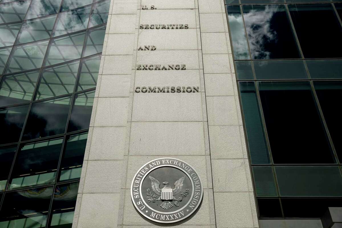 The government on Wednesday charged eight men of earning more than $100 million in stock market profits by manipulating their novice-investor followers on social media. The Department of Justice and the Securities and Exchange Commission said that from early 2020 to around April of this year the men, who had combined following of over 1.5 million on Twitter, ran a “pump-and-dump” scheme. (AP Andrew Harnik, File)