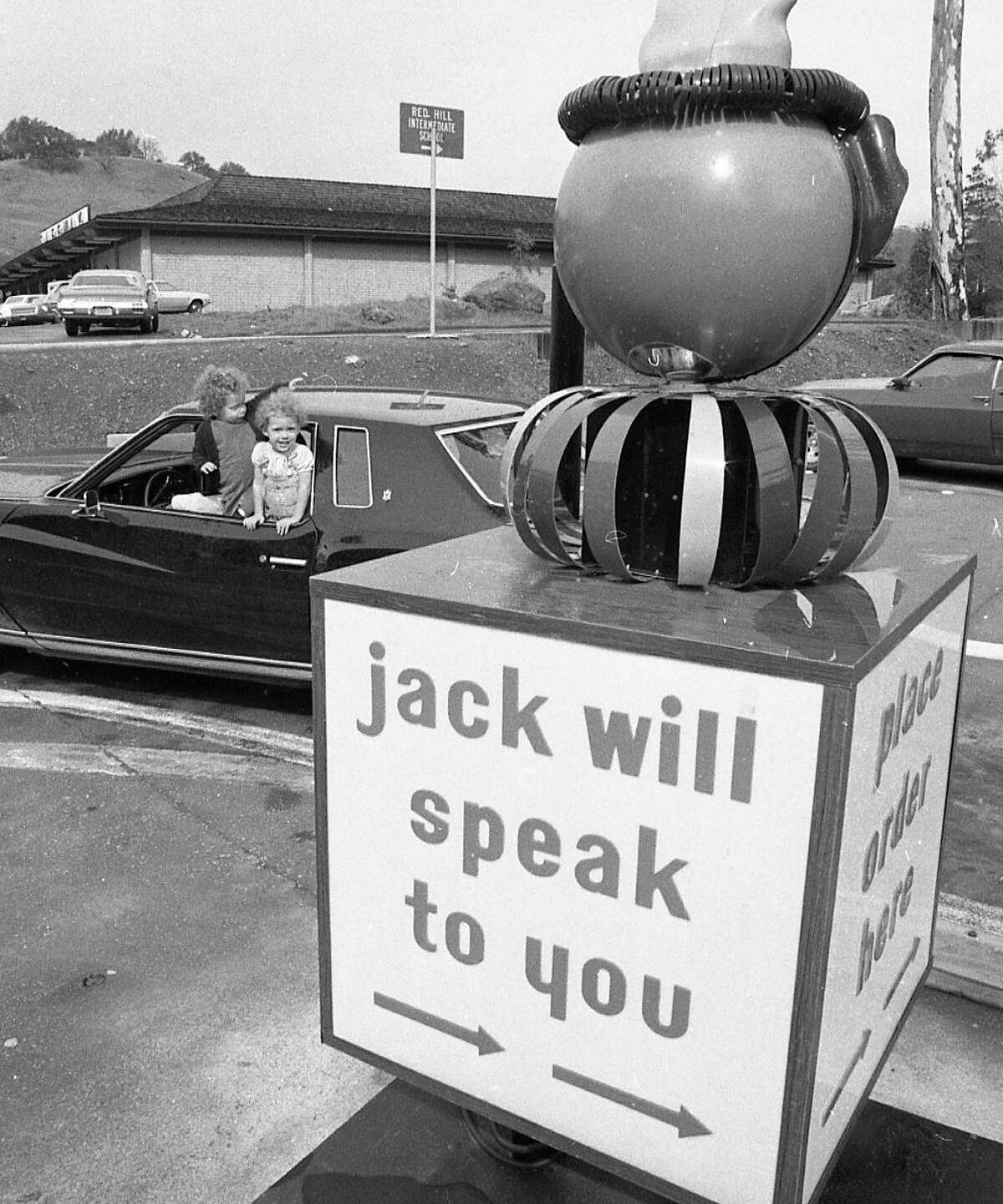 Feb. 27, 1973: A child hangs out the window near the intercom at a Jack in the Box in San Anselmo.