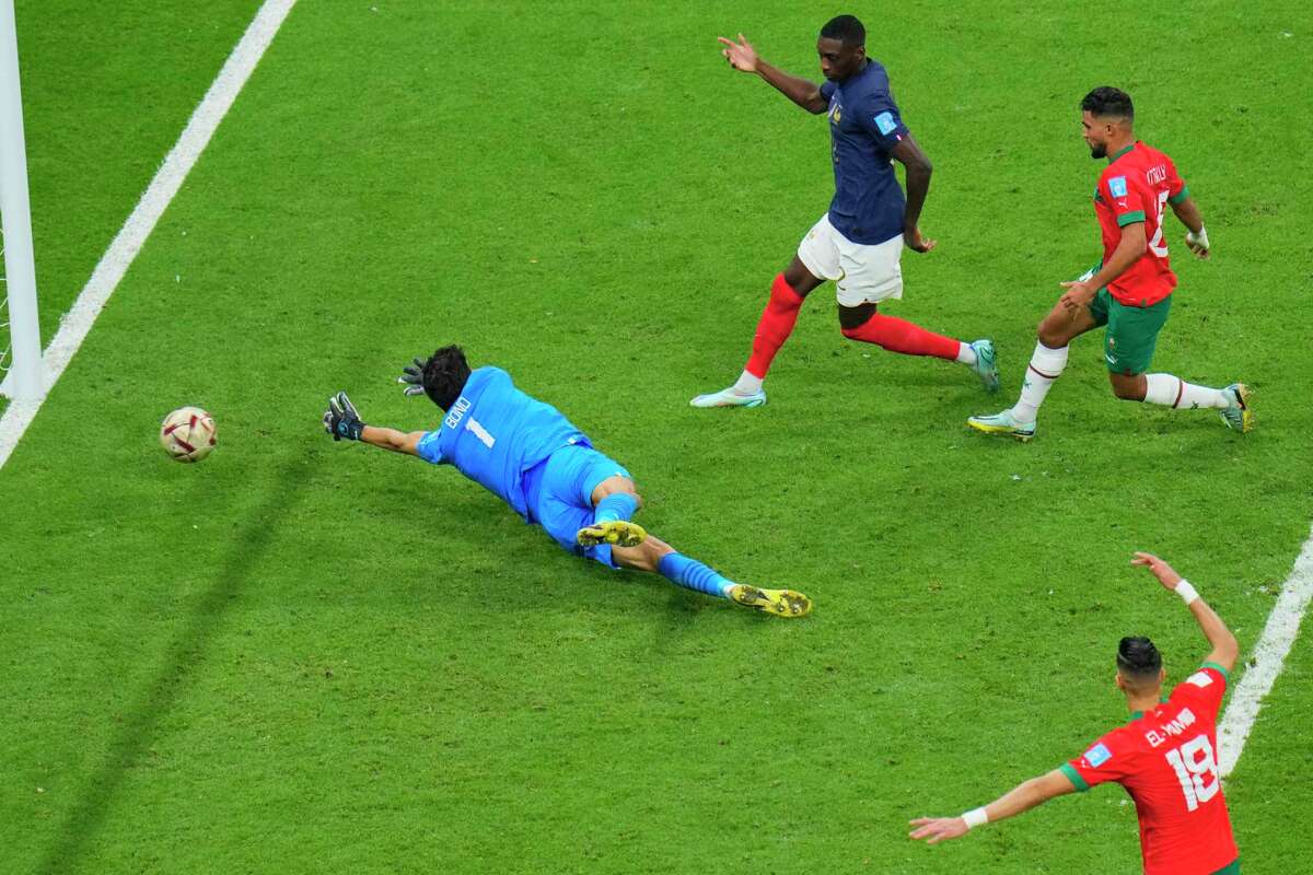 France’s Randal Kolo Muani (in blue) scores the second goal against Morocco.