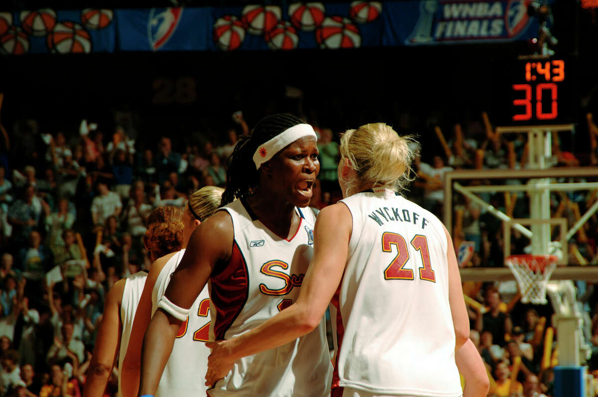 CONNECTICUT - SEPTEMBER 15: Taj McWilliams-Franklin #11 and Brooke Wyckoff #21 of the Connecticut Sun celebrate against the Sacramento Monarchs during Game 2 of the WNBA Finals at Mohegan Sun Arena September 15, 2005 in Uncasville, Connecticut. (Photo by Terrence Vaccaro/NBAE via Getty Images)