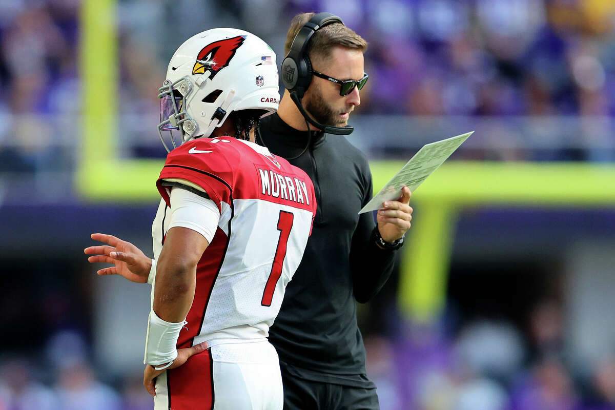 Kyler Murray #1 of the Arizona Cardinals and head coach Kliff Kingsbury talk during the second half against the Minnesota Vikings at U.S. Bank Stadium on October 30, 2022 in Minneapolis, Minnesota. 