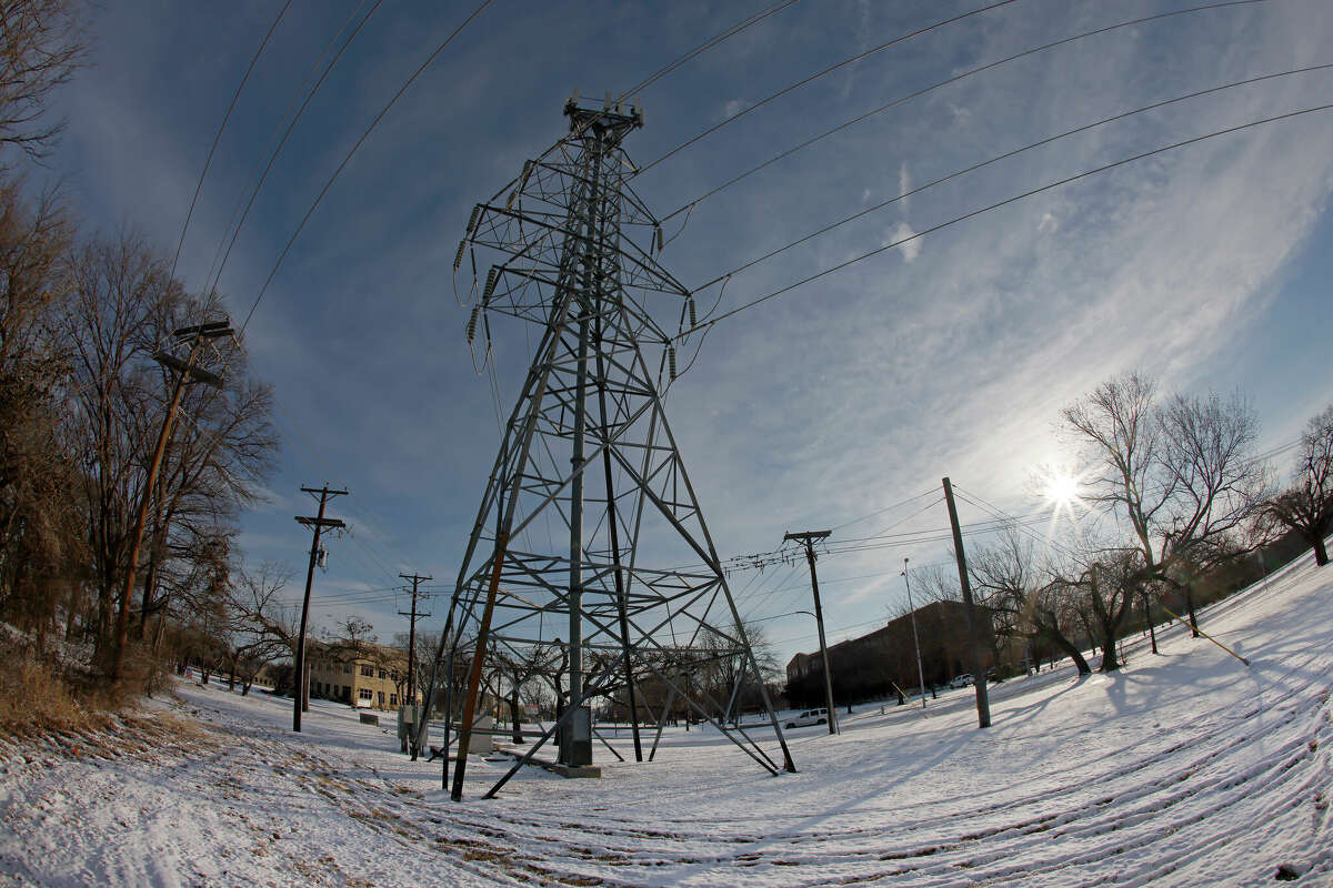 A transmission tower supports power lines after a snow storm in February 2021 in Fort Worth, Texas. 