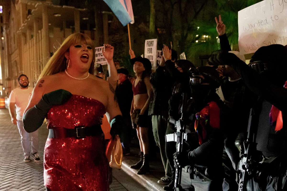 Polly Anna Rocha parades down St. Marys Street in front of San Antonio’s LBGTQ community’s counter protest to the group ‘This Is Texas Freedom Force’, that planned an armed, protest of “A Drag Queen Christmas,” at the Aztec Theater.
