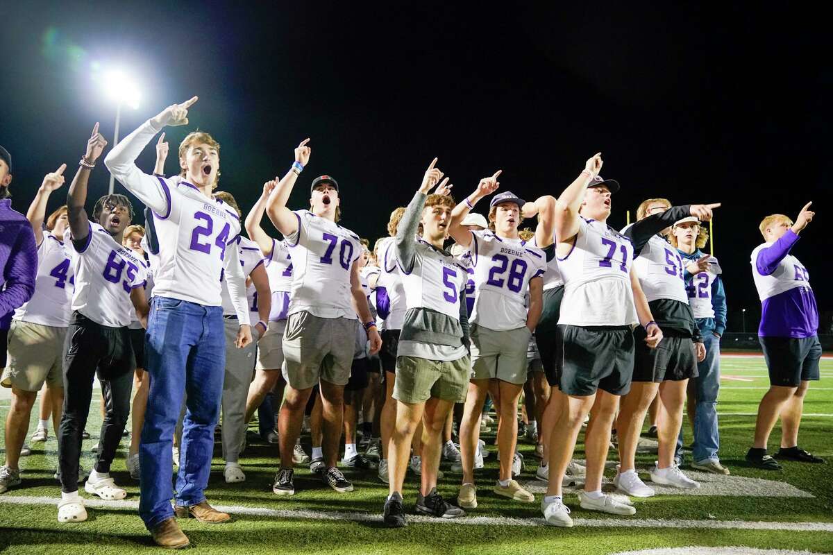 Members of the Boerne High School Greyhounds football team cheer during a pep rally for the undefeated football team Wednesday evening at Boerne ISD Stadium. The Greyhounds head to Arlington on Friday to play for the Class 4A Division 1 state championship.