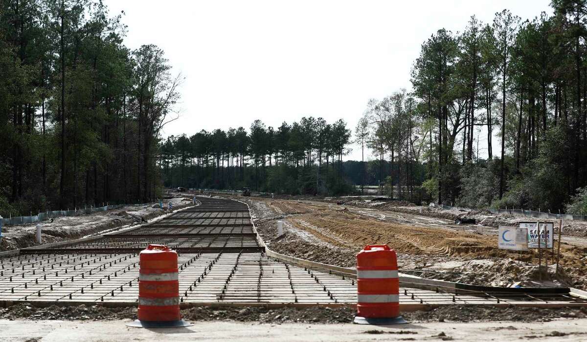 Construction continues on a new road from FM 2090, near Splendora High School, to Texas 242, Wednesday, Dec. 14, 2022, in Splendora. Montgomery County officials say the road will help with gridlock in the area by increasing mobility south to Texas 242.