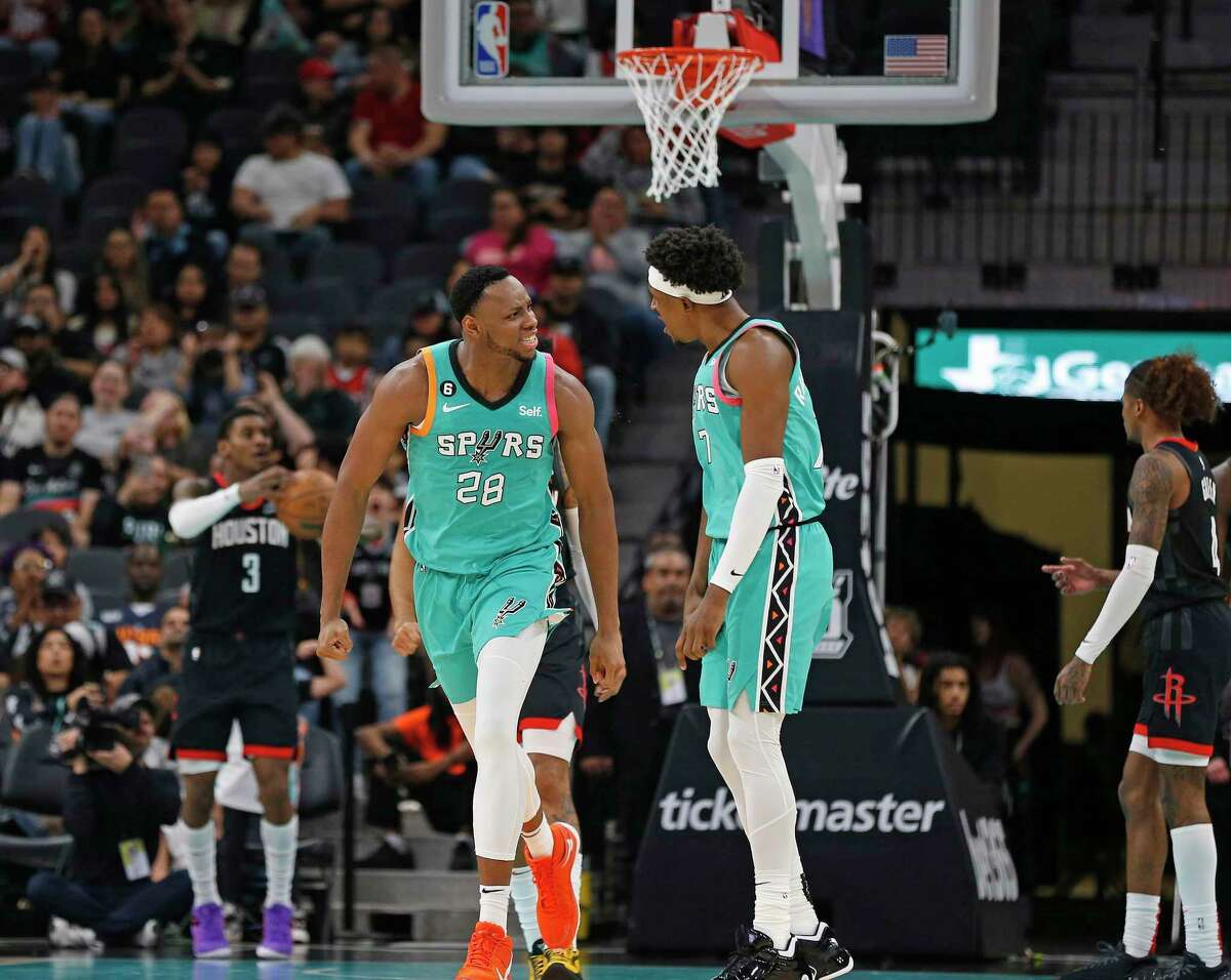 San Antonio Spurs Charles Bassey (28) reacts with Josh Richardson (7) after scoring a basket on Thursday, Dec. 8, 2022 at the AT&T Center. San Antonio Spurs defeated the Houston Rockets 118-109.