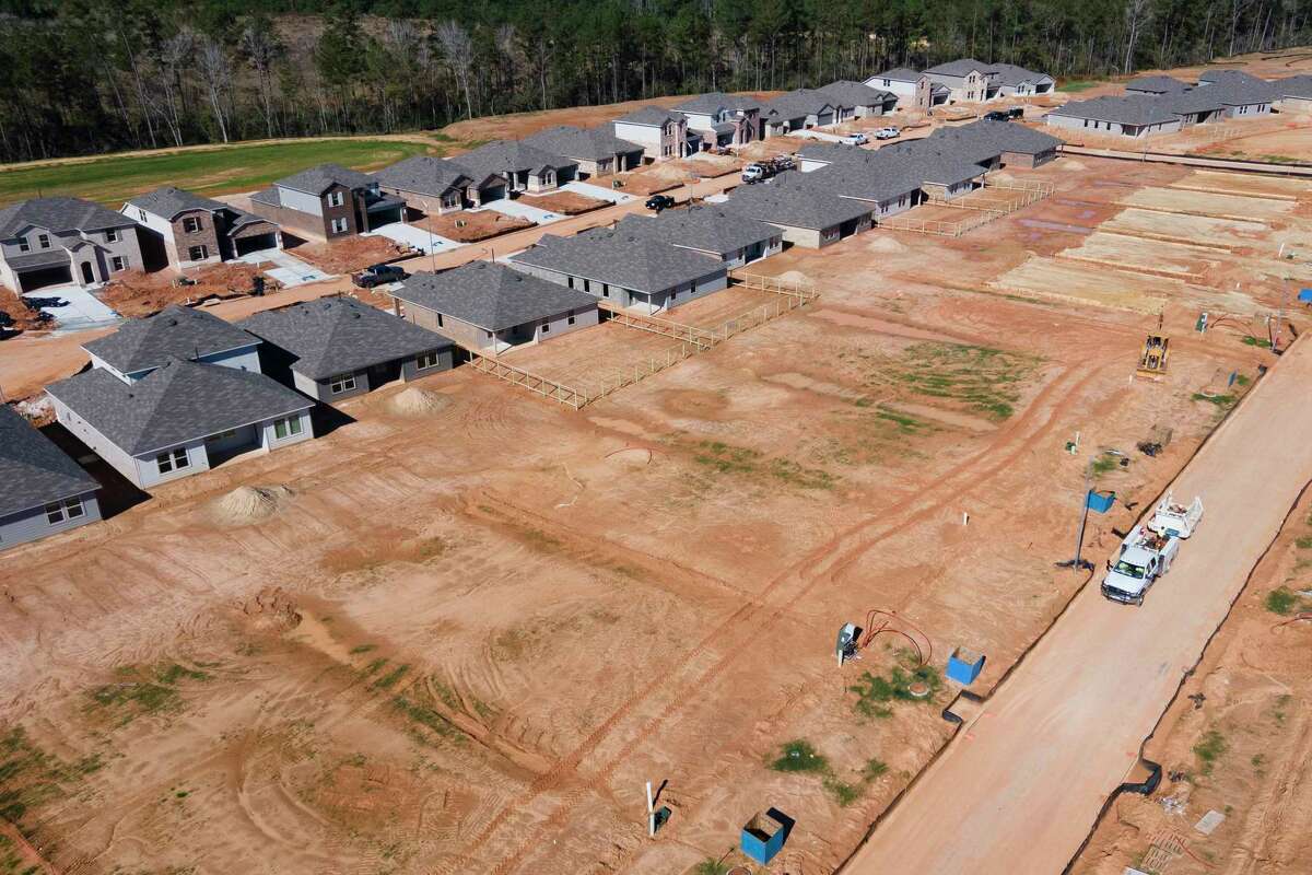 Home construction continues in the Mills Creek subdivision near FM 1488, Thursday, Dec. 15, 2022, in Magnolia. Magnolia stopped issuing new building permits Friday over officials' concerns that the city's water supply cannot keep pace with new residential and commercial development.