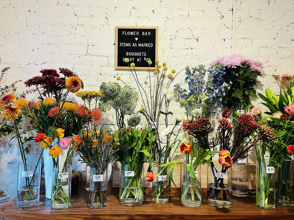 Shoppers at Hops Petunia, on the corner of Strand and Broadway, can pick up arrangements and flowers by the stem.