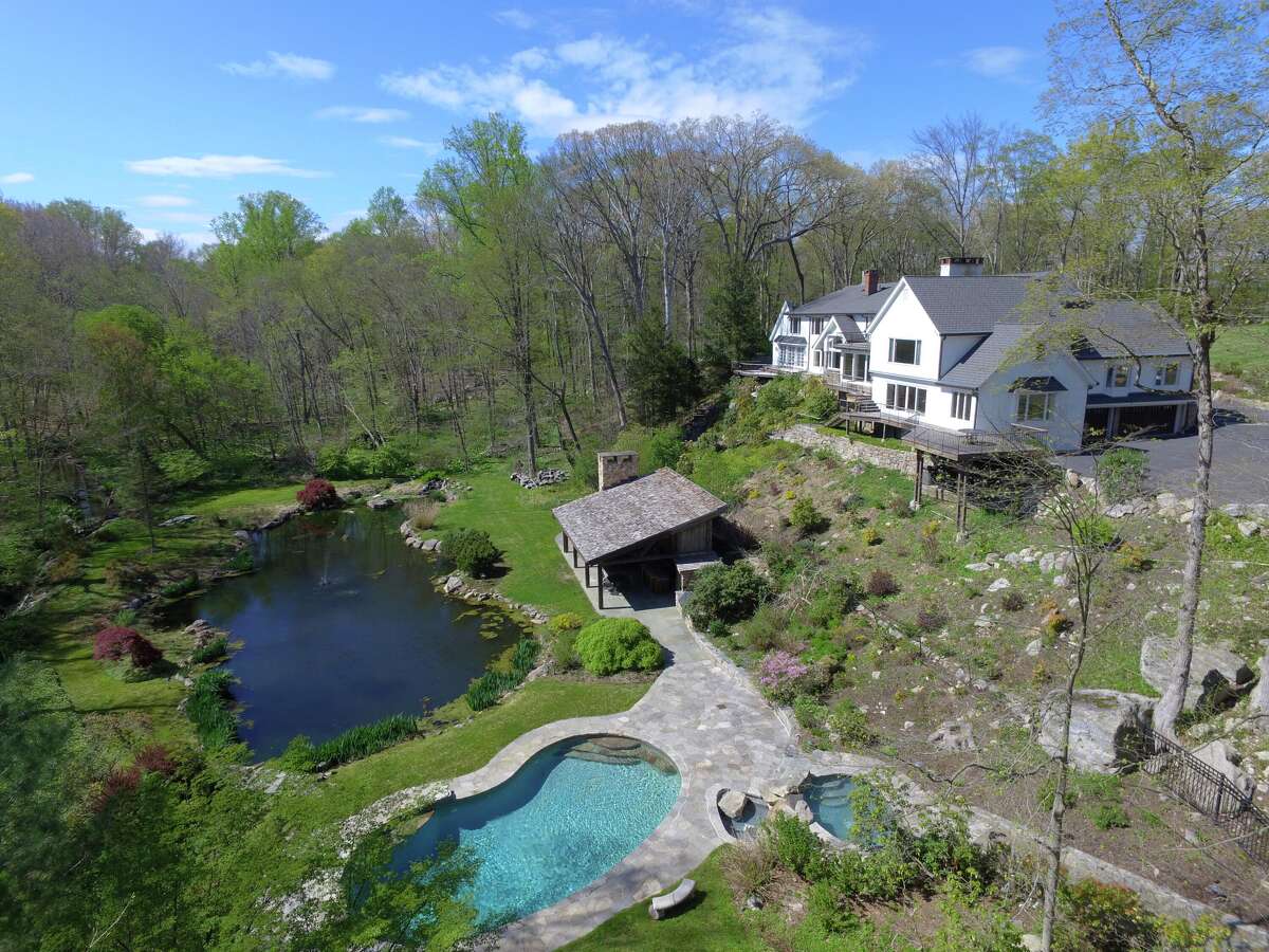 Equipped with its own private movie theater, Broadway-style stage and basketball court, a 6.43-acre estate at 360 and 364 Laurel Road in New Canaan is on sale for $5,955,000. 