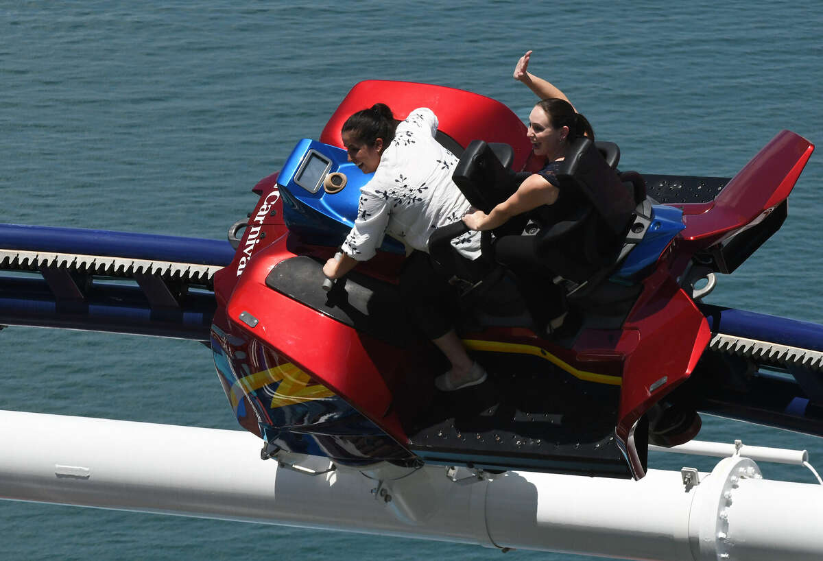 People ride the Bolt roller coaster on Carnival Cruise Line's ship Mardi Gras during a preview for travel agents and media on July 30, 2021. The thrill ride, the first of its kind on a cruise ship, can also be found on the Carnival Celebration.