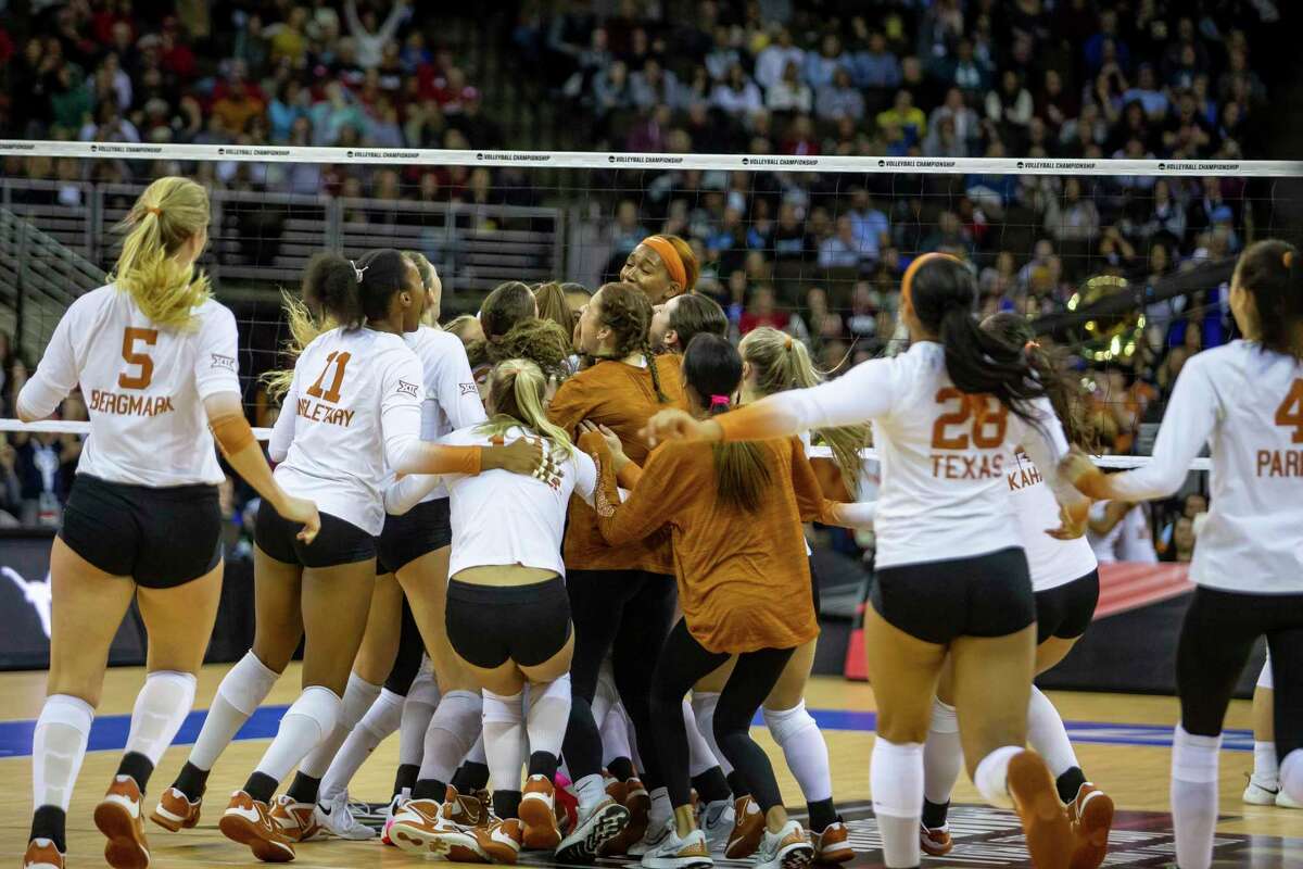 Texas players celebrates their win over San Diego in four sets in the semifinals of the NCAA women's volleyball tournament, Thursday, Dec. 15, 2022, in Omaha, Neb. (AP Photo/John S. Peterson)