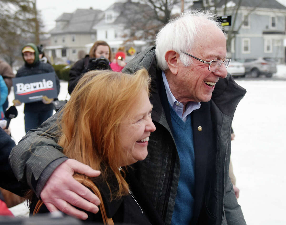 U.S. Sen. Bernie Sanders, I-Vermont, campaigns with his wife, Jane O'Meara Sanders, during the New Hampshire Presidential Primary at McDonough School in Manchester, N.H. Tuesday, Feb. 11, 2020. 