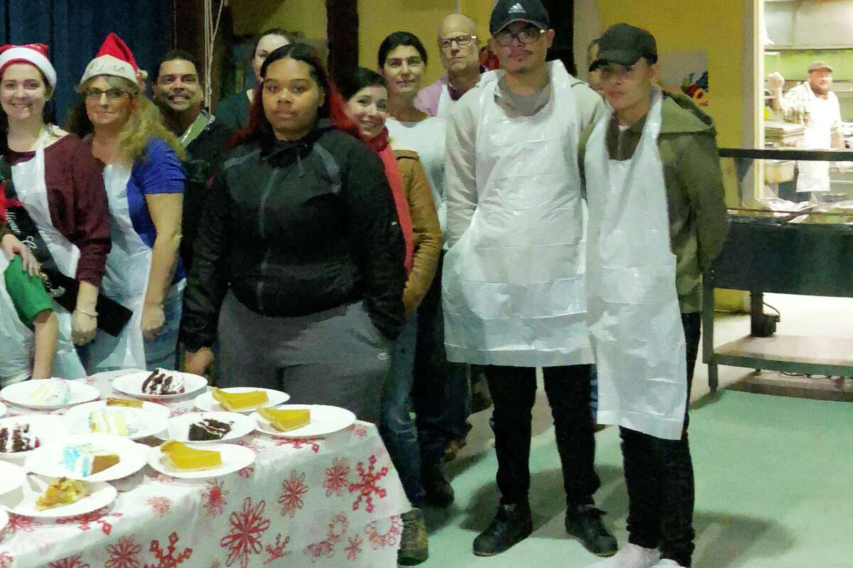 Robert Hoagland, third from right, appears in a 2017 group photo of Christmas day volunteers at the Sullivan County Federation for the Homeless in Monticello, N.Y.