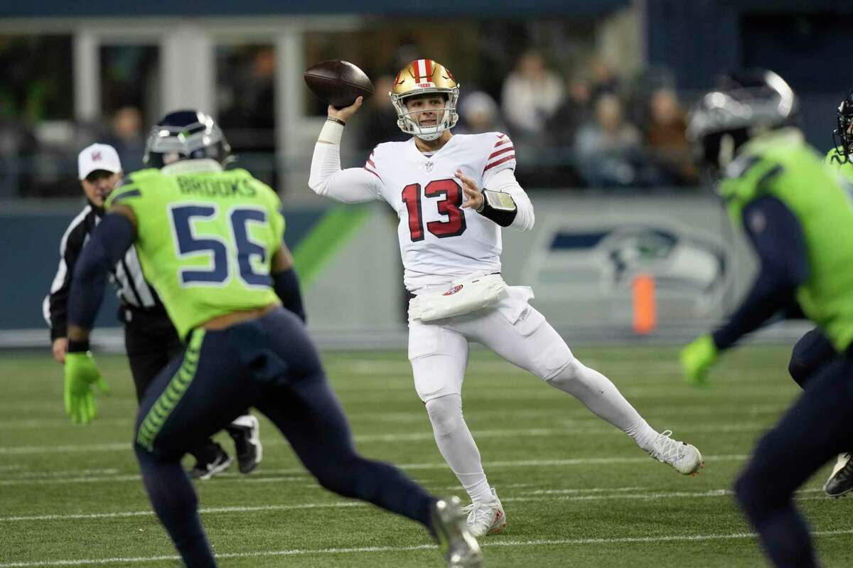 San Francisco 49ers quarterback Brock Purdy (13) passes against the Seattle Seahawks during the second half of an NFL football game in Seattle, Thursday, Dec. 15, 2022. (AP Photo/Stephen Brashear)