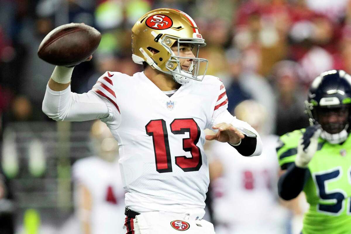 SEATTLE, WASHINGTON - DECEMBER 15: Brock Purdy #13 of the San Francisco 49ers throws a pass against the Seattle Seahawks during the third quarter at Lumen Field on December 15, 2022 in Seattle, Washington. (Photo by Christopher Mast/Getty Images)