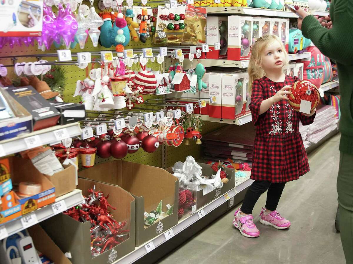 Sicily Albora, 4, shows her grandmother, Carol, an ornament in the seasonal aisle at HEB’s Bunker Hill location.