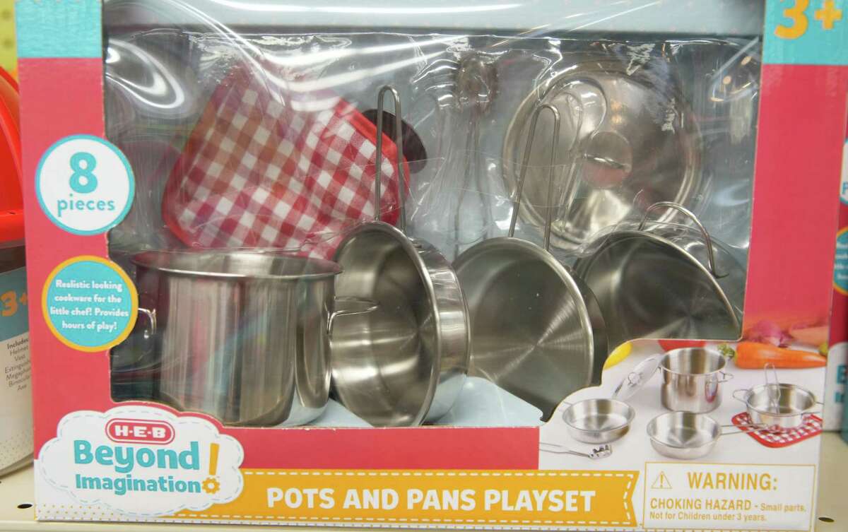 A variety of kitchen and household-goods themed toys, including pots and pans, are available in the seasonal aisle.