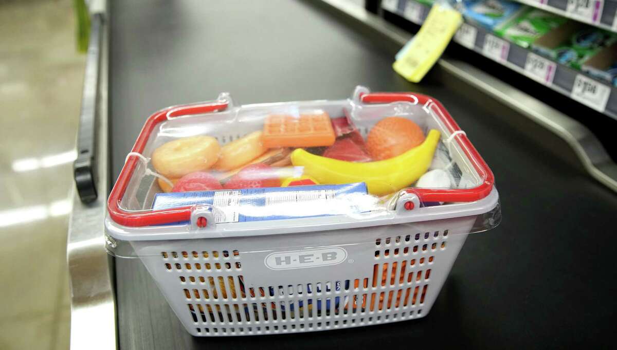 An HEB shopping basket with food items is one of the toy options in store. 