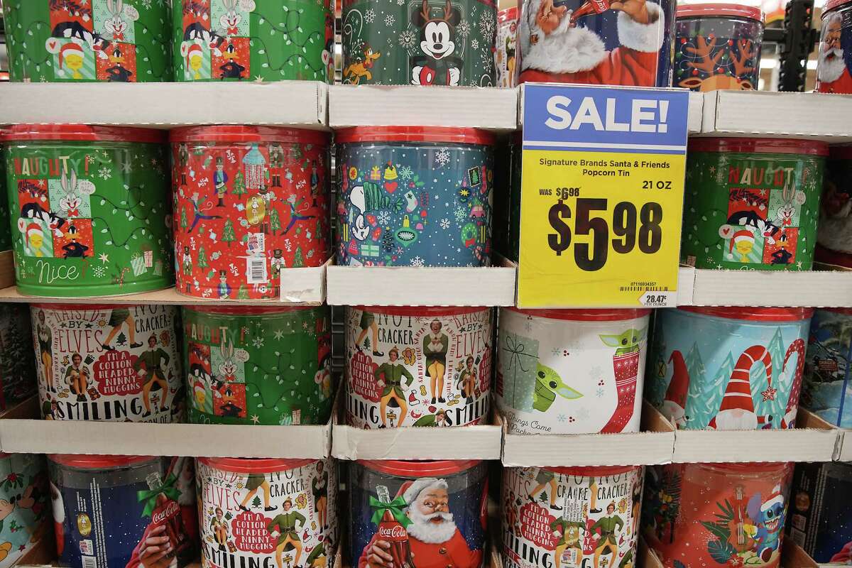 Popcorn in holiday-themed tins.