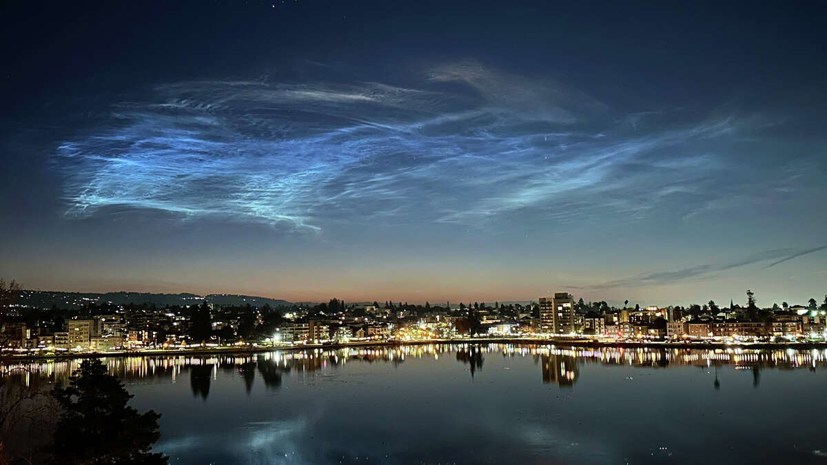 Oakland resident Rain Hayes captured a photo of rare noctilucent clouds over Lake Merritt early Dec. 16.