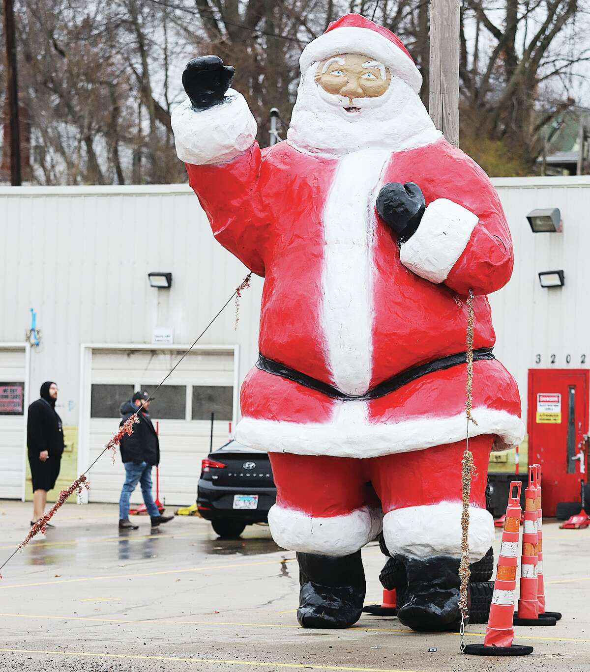 John Badman|The Telegraph The large fiberglass Santa returned to Cheapies Tires, 3202 E. Broadway in Alton, this week. Santa is there to greet passing motorists, and this year Santa isn't wearing the surgical mask he sported at the height of the COVID-19 pandemic.
