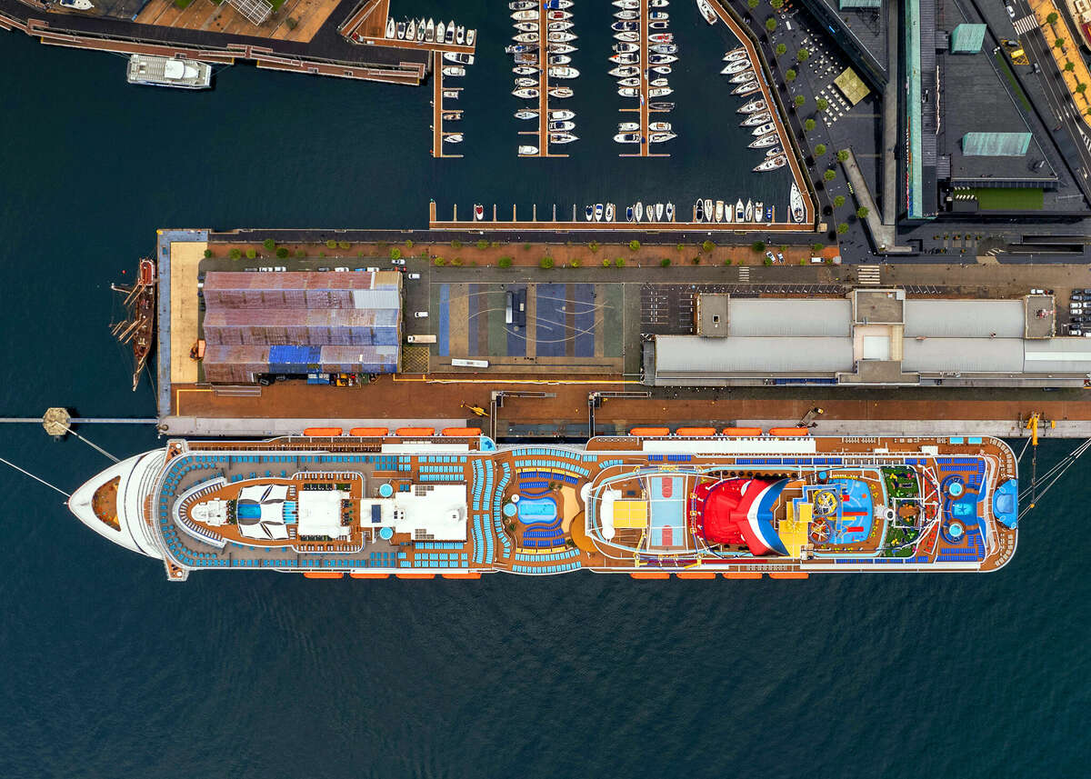 The cruise ship Carnival Celebration is seen overhead as it docks at the Port of Vigo in Spain.